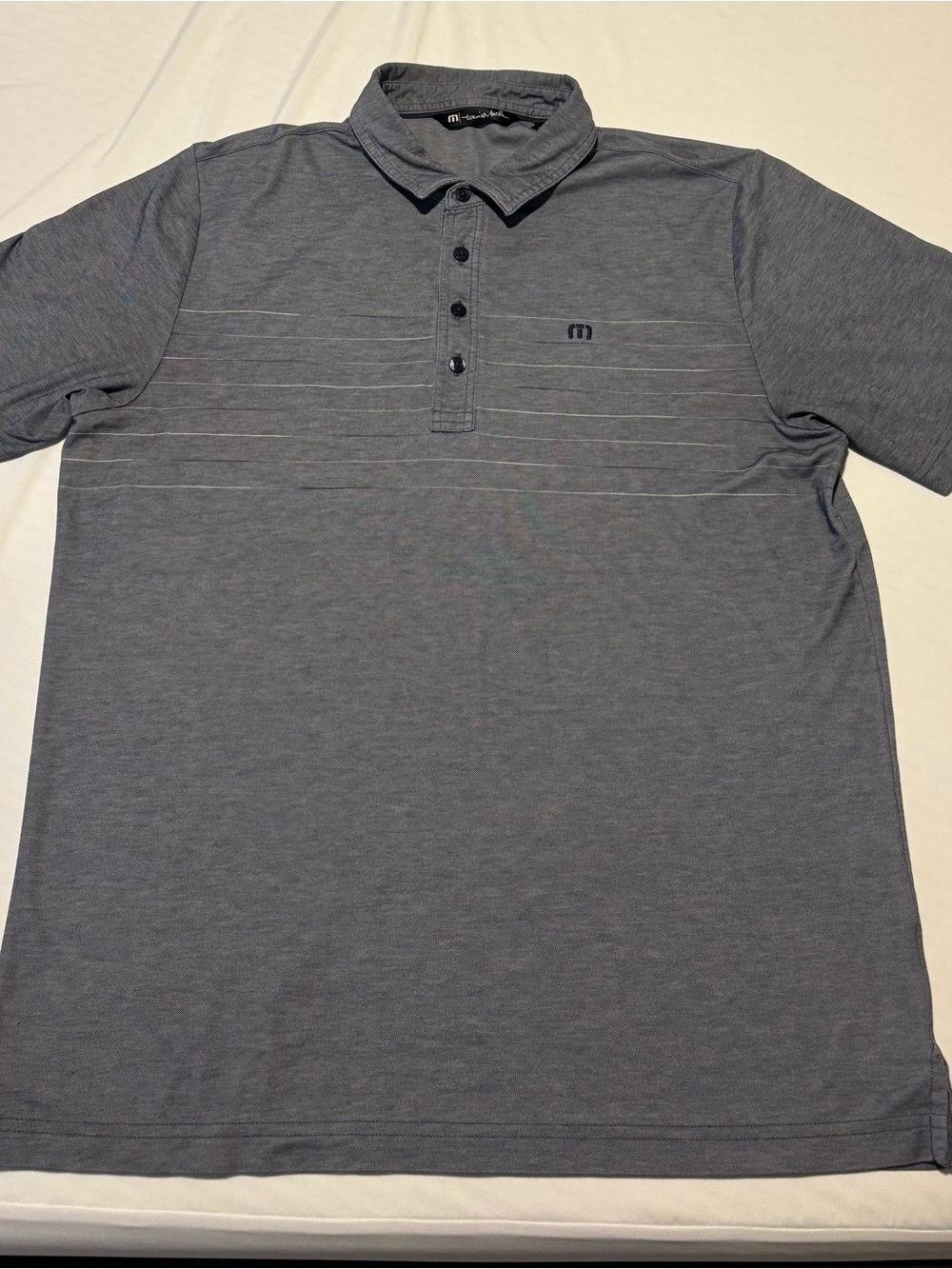 Travis Mathew Men's Heathered Light Blue Polo